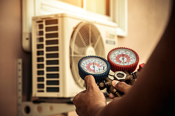 Professional Air Conditioning Service technician working in Patterson, NY